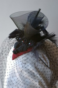 A sample of our hats-- Black veiled fascinator-style hat... base color can be changed.  Ask about multiple hats for your bridesmaids.